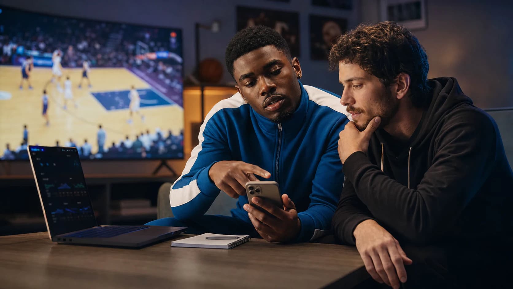 Sports analysts reviewing picks together during a live game